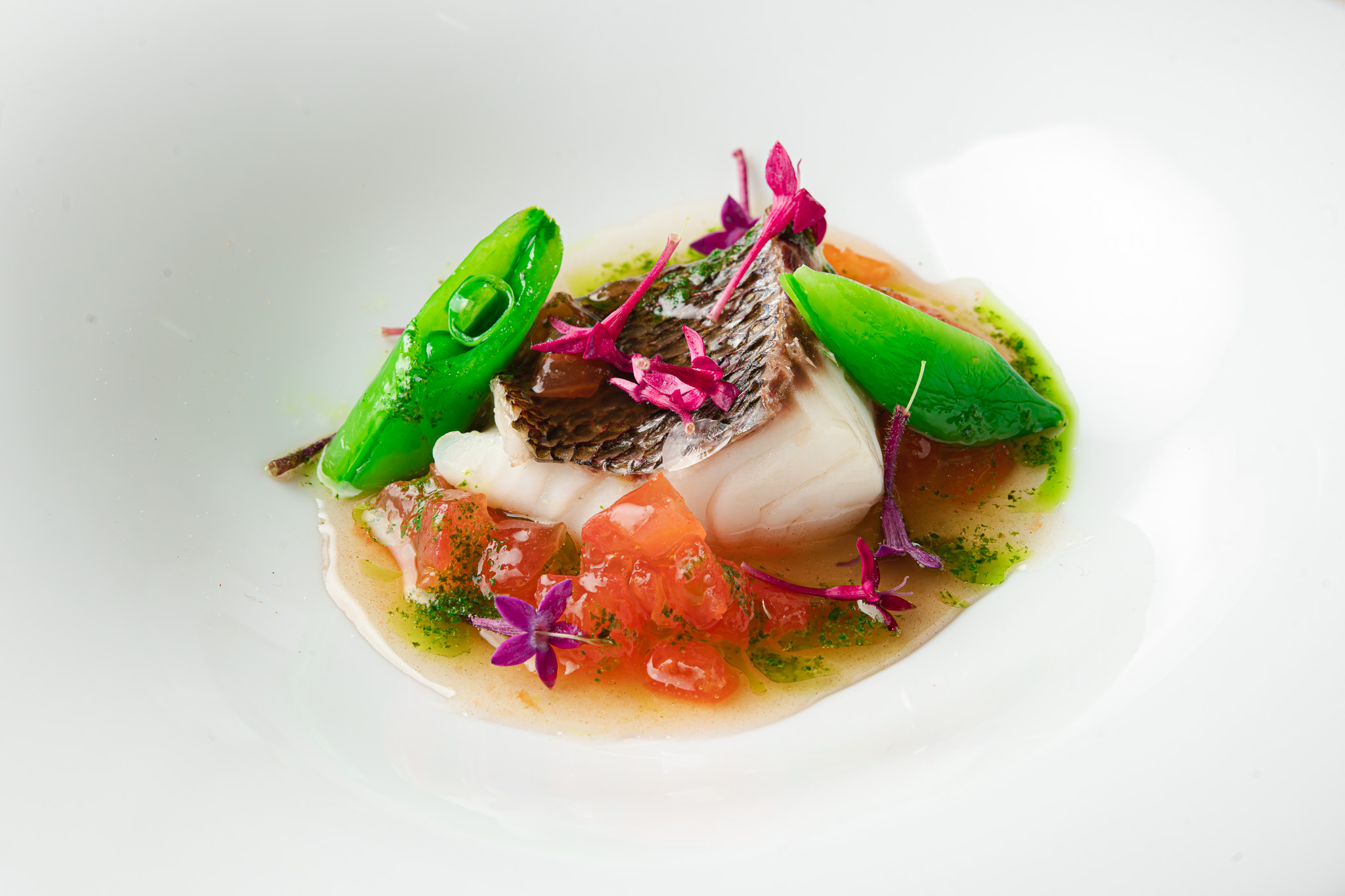 Flambeed abalone detail over salt