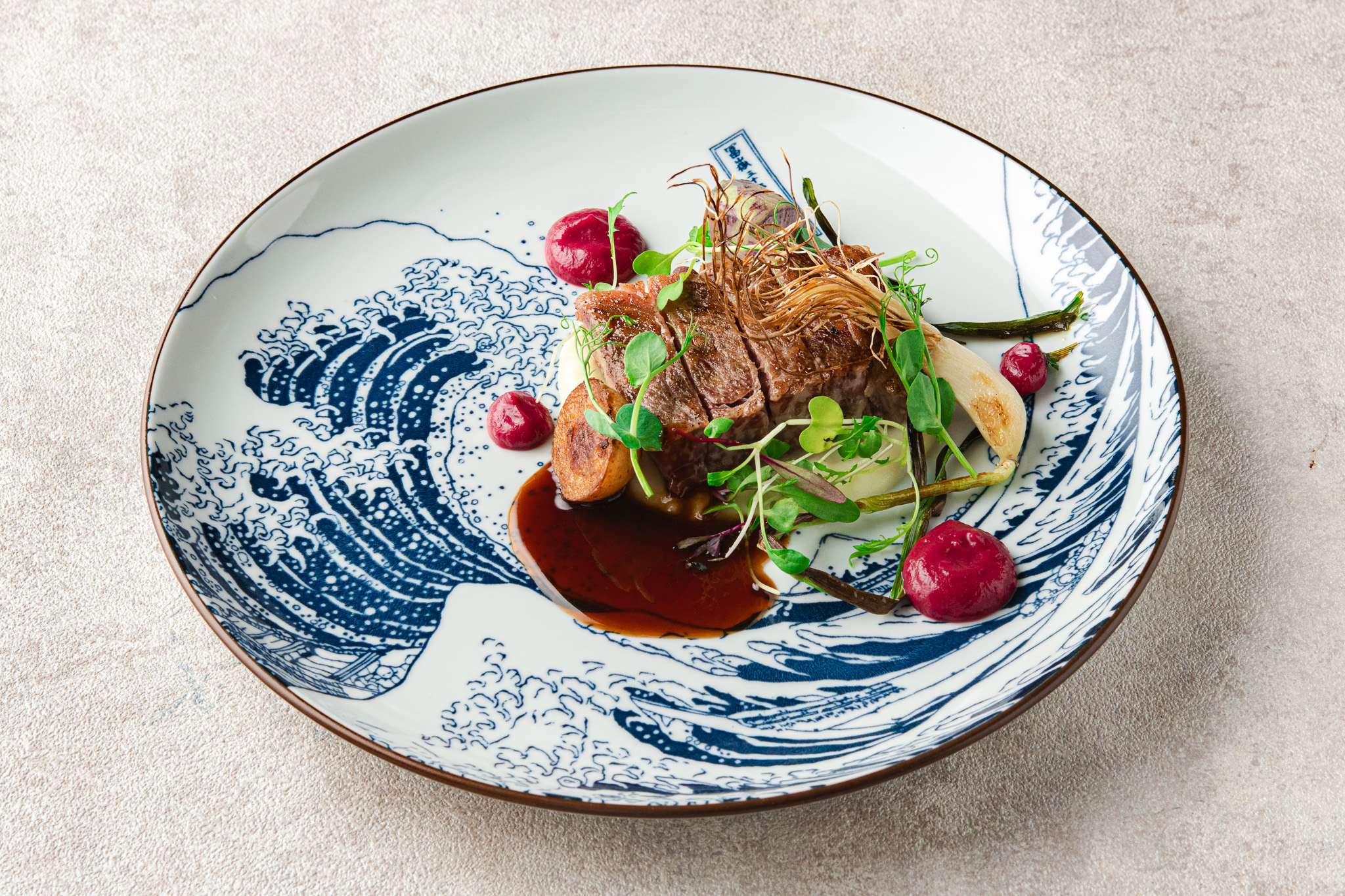 Signature dessert served on a dark plate